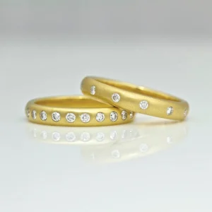 Yellow gold rings flush set diamonds