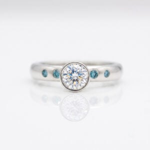 Rubover set blue and white diamond ring