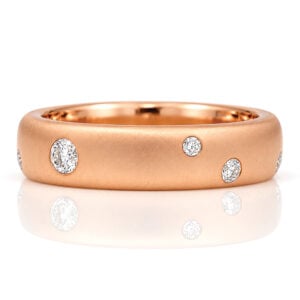 18ct rose gold wide ring with random size diamodns flush set.