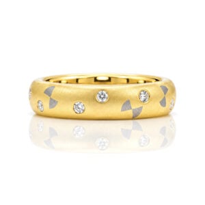 18ct gold ring with bowties and diamonds