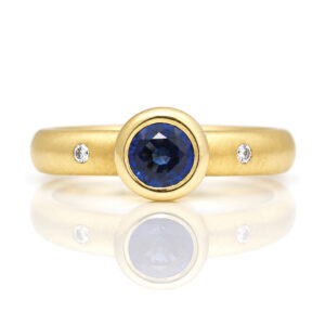 rub-over sapphire ring