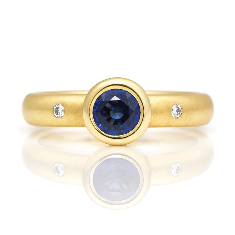 rub-over sapphire ring