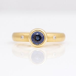 rub-over sapphire ring