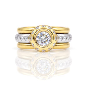 Rub-over set natural diamond set in yellow gold with flush set diamonds in Platinum stacking rings 0852