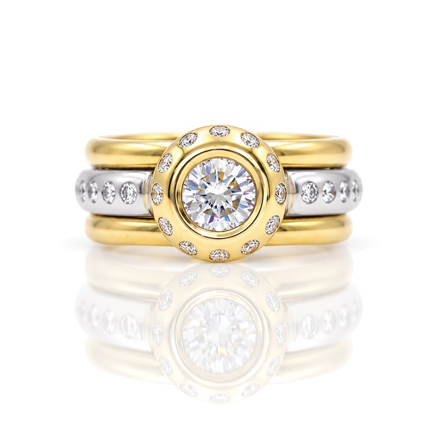 Rub-over set natural diamond set in yellow gold with flush set diamonds in Platinum stacking rings 0852