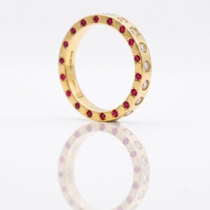rubies and diamonds flush set in gold ring