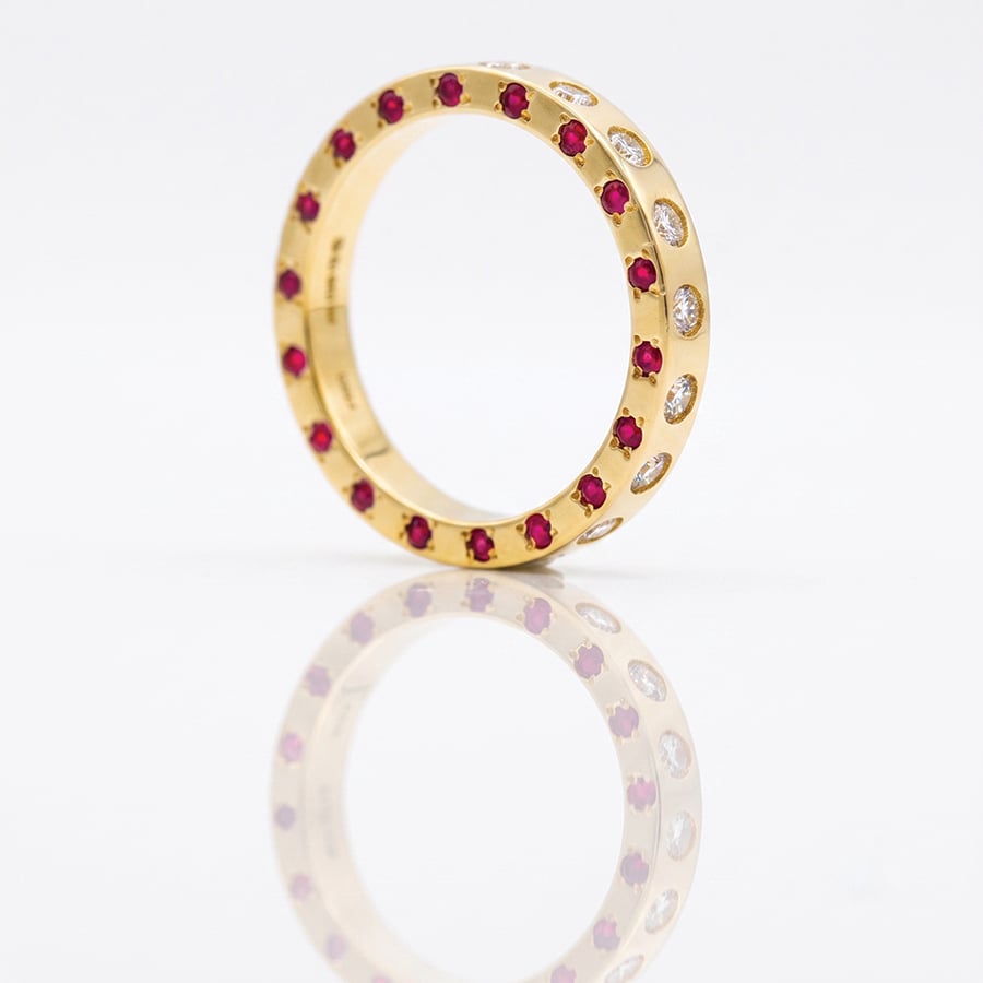 rubies and diamonds flush set in gold ring
