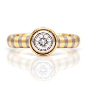 rub-over set diamond engagement ring with unique 18ct yellow and white gold stripe band David Ashton 0952