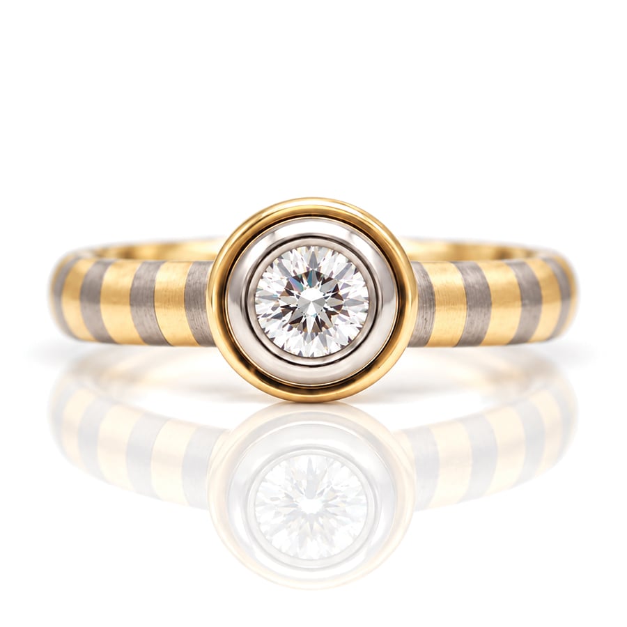rub-over set diamond engagement ring with unique 18ct yellow and white gold stripe band David Ashton 0952