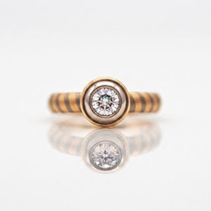 rub-over set diamond engagement ring with unique 18ct yellow and white gold stripe band David Ashton 0952