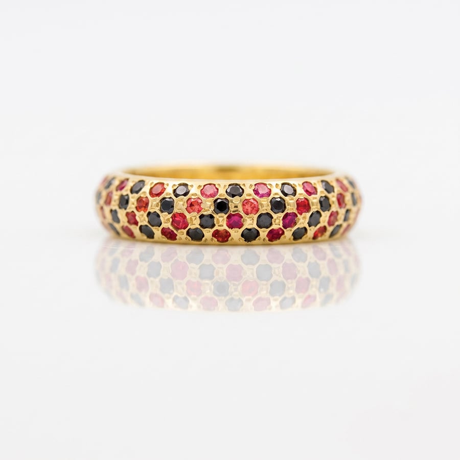 orange and black stone eternity ring