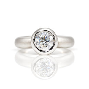 Modern diamond engagement ring rub-over set Platinum David Ashton