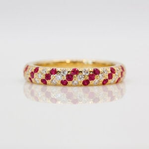 Natural rubies and diamonds pave set in yellow gold ring