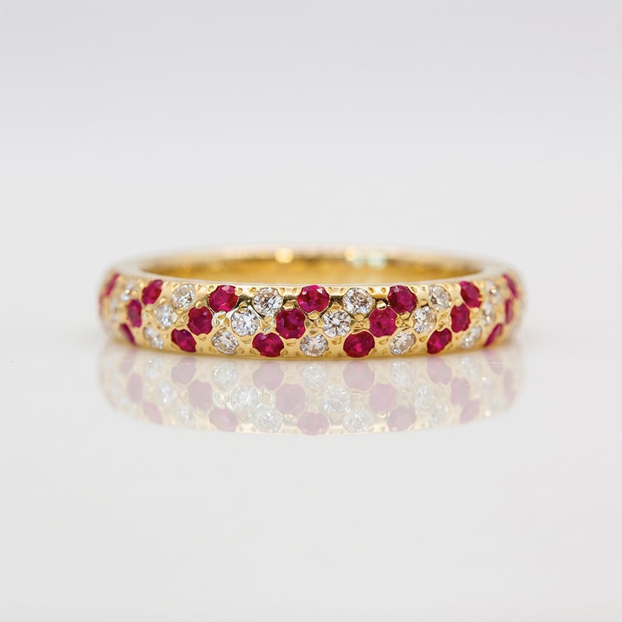 Natural rubies and diamonds pave set in yellow gold ring