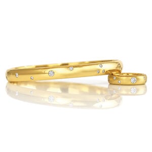 18ct yellow gold 6.6mm solid bangle with flush set diamonds