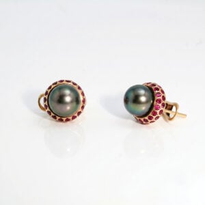 Tahitian pearls, with the finest rubies set in yellow gold contemporary ear-studs