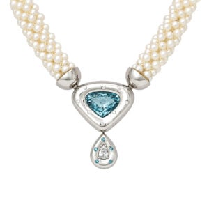 perfect blue aquamarine rub-over set in platinum with blue and white diamonds on pearl tube necklace David Ashton modern fine jewellery handmade in London