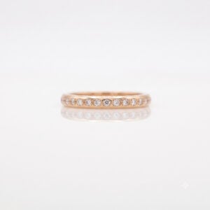 Narrow rose gold ring pave set with diamonds
