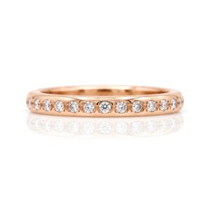 Narrow rose gold ring pave set with diamonds