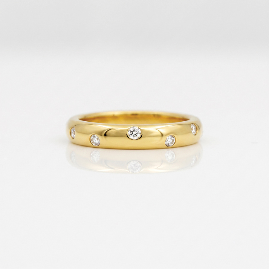 Diamonds radomly fush set in 18ct gold ring