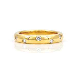 Diamonds radomly fush set in 18ct gold ring
