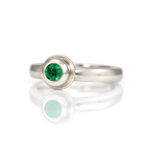 Intense green round emerald rub-over set in Platinum modern ring David Ashton 0709 jewellery handmade in London bespoke
