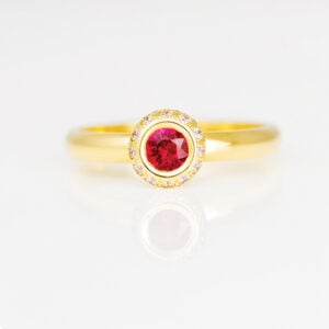 Ruby framed with diamonds 18ct ring