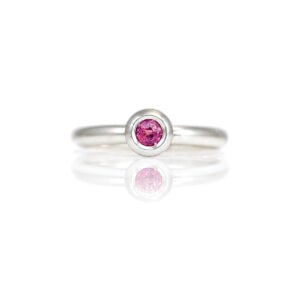 Natural ruby rub-over set in Platinum ring