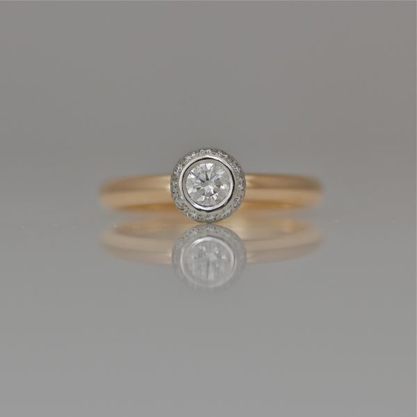 Diamond framed with diamonds set in Platinum on rose gold ring