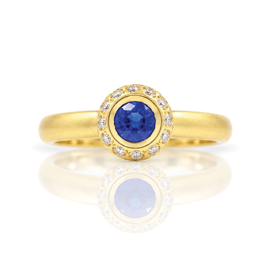 Modern sapphire and diamond yellow gold engagement