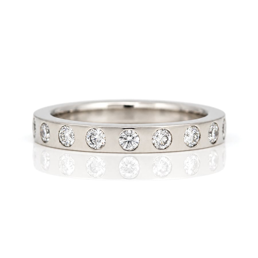 Platinum flat profile ring with natural diamonds evenly flush set David