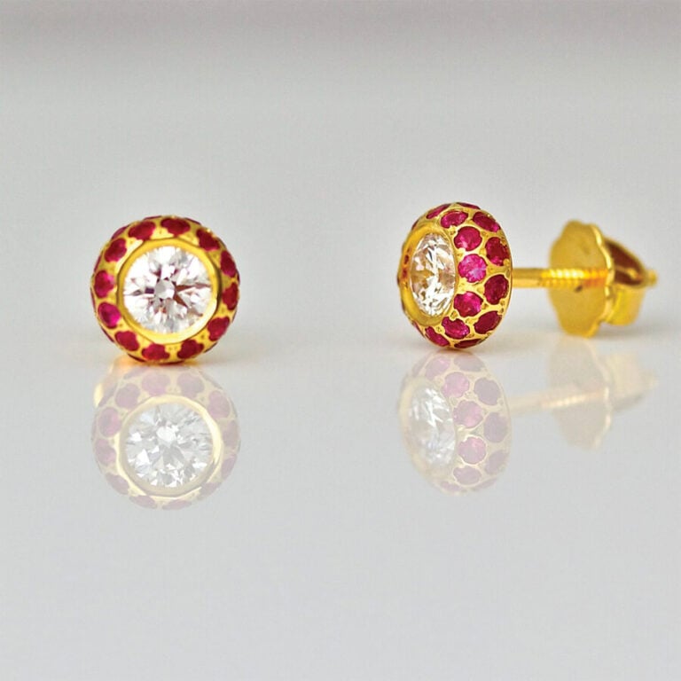 Diamond & Ruby ear-studs in 18ct gold.