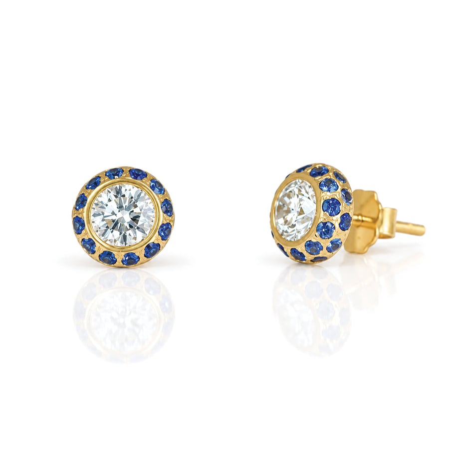 Sapphires frame a single brilliant cut diamond set i yellow gold ear studs