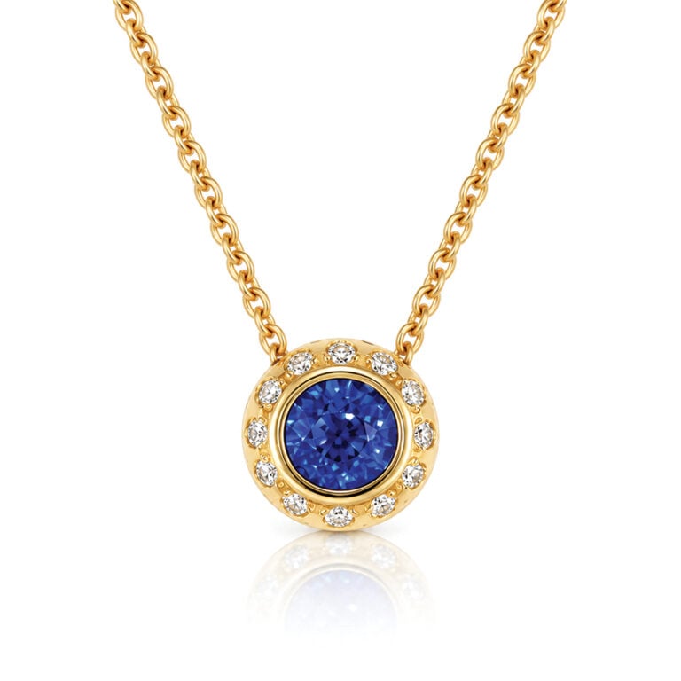 Vivid blue sapphire with diamonds 18ct gold modern pendent