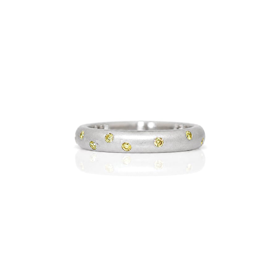 Randomly set yellow diamonds in Platinum ring