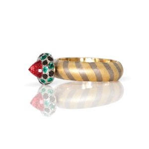 Modern orange sapphire framed with emeralds and black diamonds on diagonal stripe 18ct gold ring