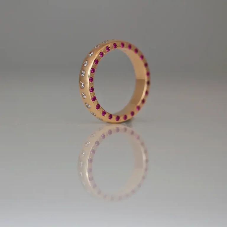 Rubies & diamonds flush set in rose gold ring