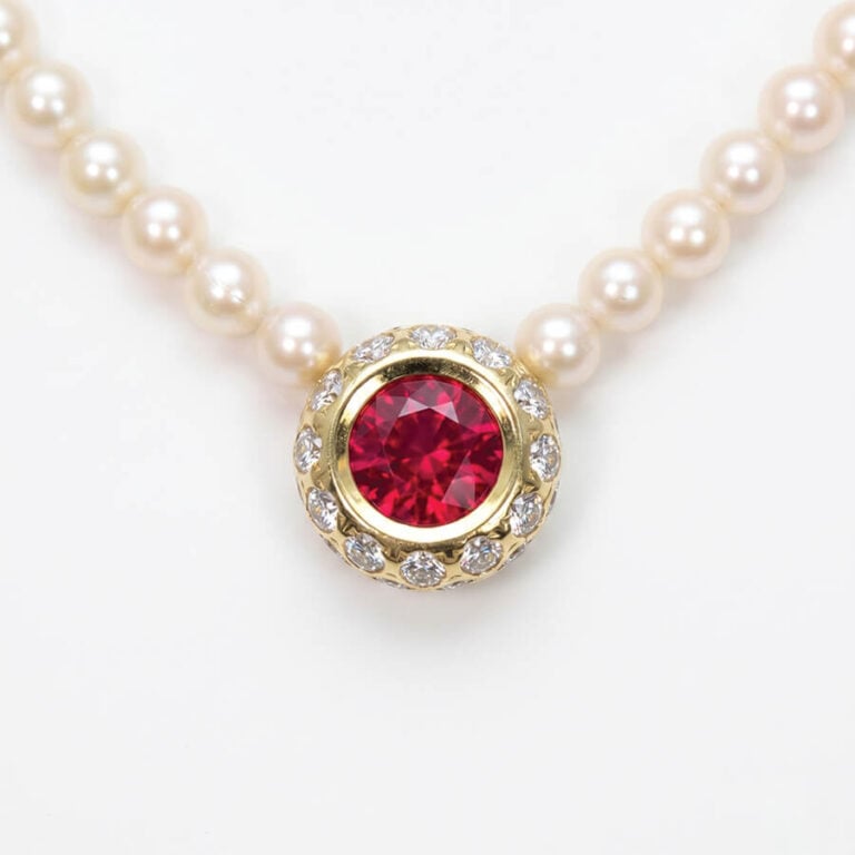 Burmese ruby necklace, with diamond halo.