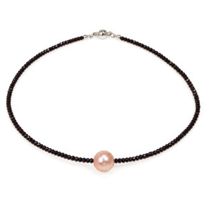 A pinky peach natural colour pearl in the middle of a string of faceted black spinel. bespoke fine modern jewellery handmade in London