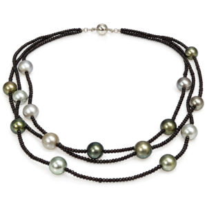 Three strings of faceted black spinel, with randomly spaced Tahitian pearl necklace