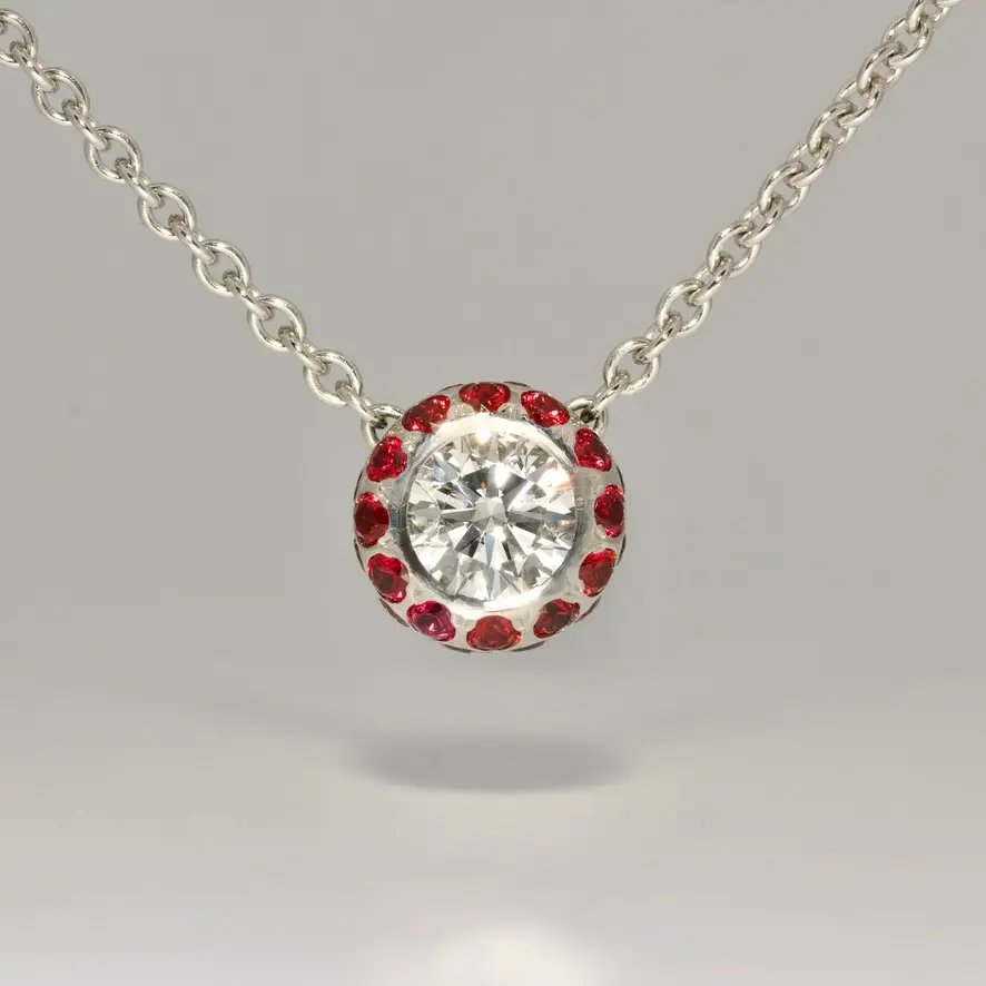 Natural diamond set in Platinum with ruby necklace. Modern fine jewellery handmade in London bespoke