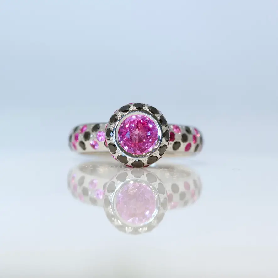 Pink sapphire & black diamond ring.