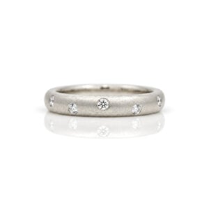 Diamonds randomly flush set Platinum. ring 0812 David Ashton