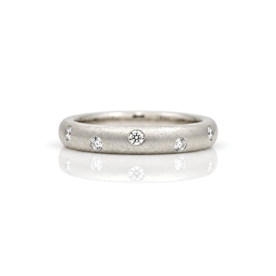 Diamonds randomly flush set Platinum. ring 0812 David Ashton