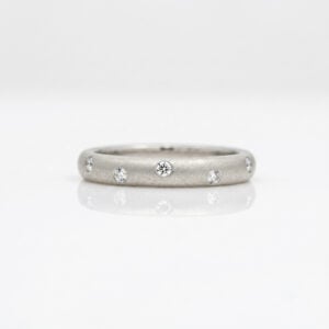 Diamonds randomly flush set Platinum. ring 0812 David Ashton