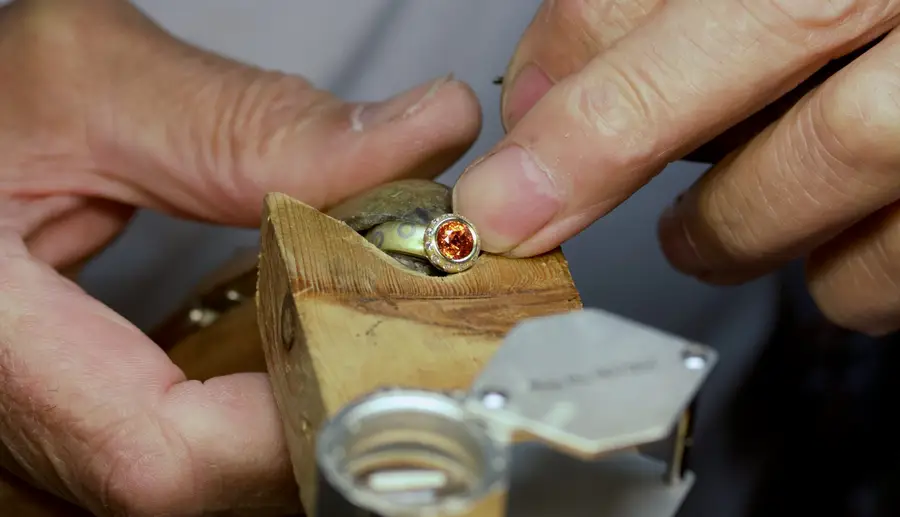 David Ashton making orange sapphire ring