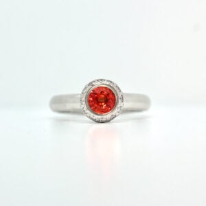Orange sapphire with white diamond Platinum ring